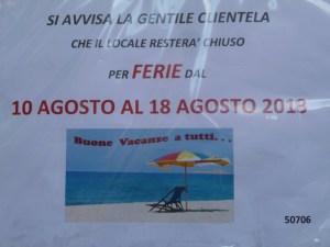 A more formal sign assures  customers of this cafe that they will only be closed a week.  Everyone to the beach!
