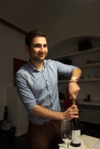 Our sommelier Maurizio opens a special bottle. Photo by Michael Horne, Dall'Uva.