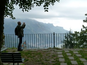Photographer on the edge. Beautiful vista over the Mediterranean. 