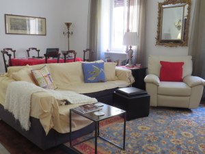 We have a large "sala," a combined living room and dining room. Some of our landlady's antiques combined with our comfy recliner, our rugs, and a modern sofa. 