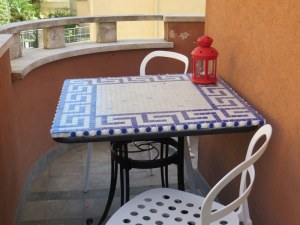 The terrace is narrow, but wraps around the bedroom and there is just enough room for two to sip wine.