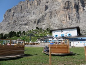 Snuggled up against the Sassolungo, there is an vast terrace and lawn. The little pods swivel on their bases.