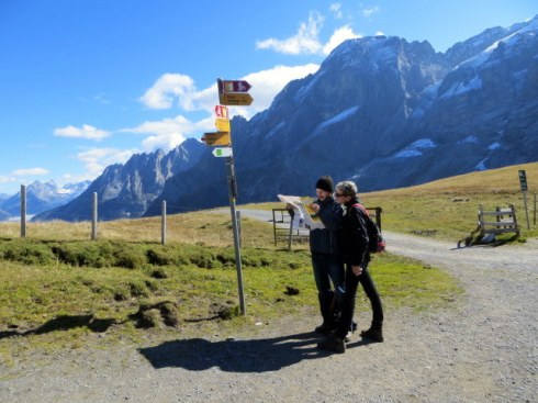 Which way? I love this picture Ric took of two hikers standing beneath a way-finding sign looking at their map. 