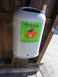 Typical refuse receptical in the street. Note the little chimney for butts. 