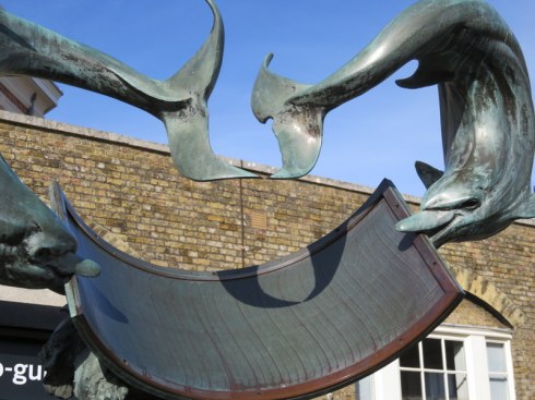Royal Observatory, Greenwich. This is a sundial and the dolphin tails point to the hour. 