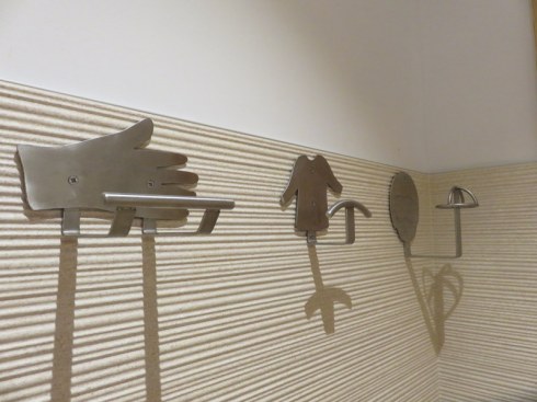 So you go into a stall with a backpack, hiking poles, a jacket. Where to put your stuff? Each stall has generous and thematic hooks.