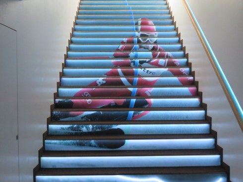 On the way out, the lighted stairway is enhanced with a skiing graphic. 