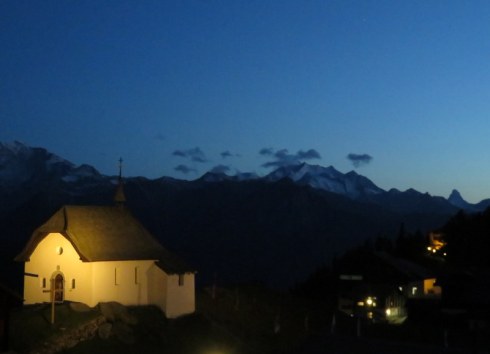 chapel on a hill at night